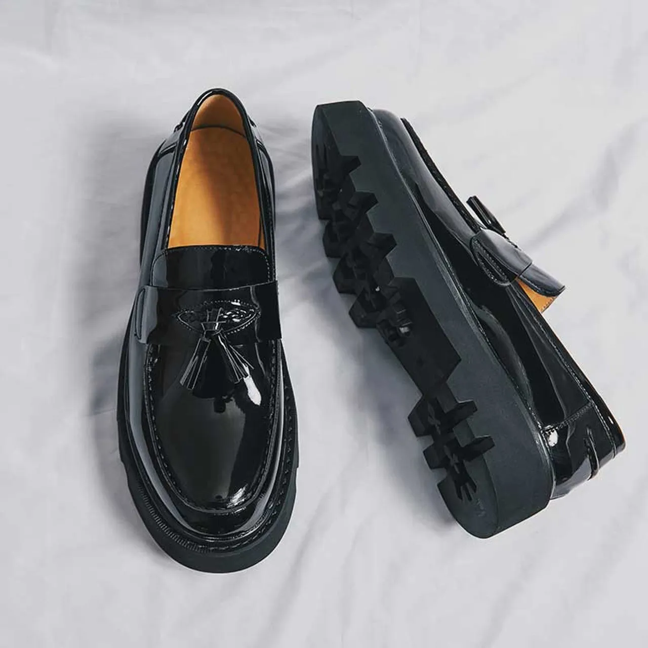 Black patent tassel on top penny slip on dress shoe