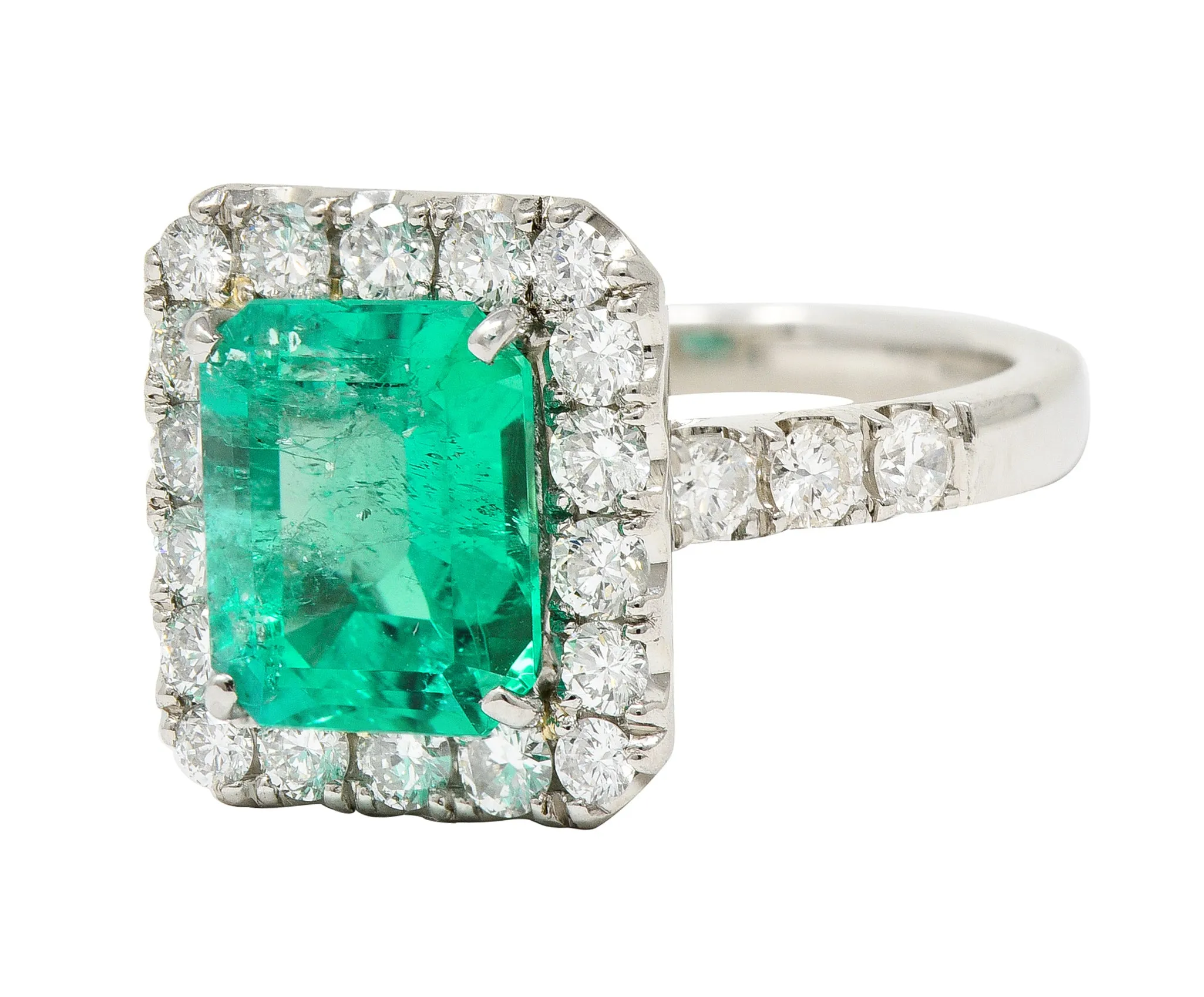 Contemporary 3.50 CTW Colombian Emerald Diamond Platinum Halo Ring GIA